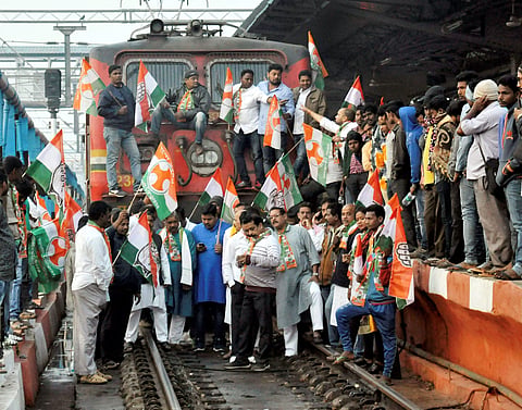 Congress workers stop a train at Bhubaneswar railway station during statewide protest over the alleged suicide of Kunduli gang rape victim (File | PTI)