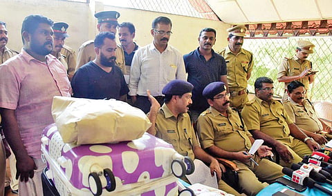 The Excise Enforcement Squad with the arrested persons at a press meet in Aluva on Saturday | Albin Mathew