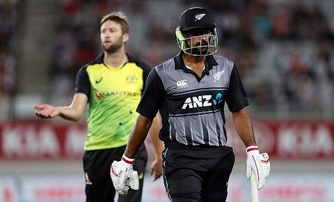New Zealand's Ish Sodhi (R) walks off after being dismissed by Australia's Andrew Tye (L) during the final Twenty20 Tri Series international cricket match between New Zealand and Australia at Eden Park in Auckland on February 21, 2018. | AFP