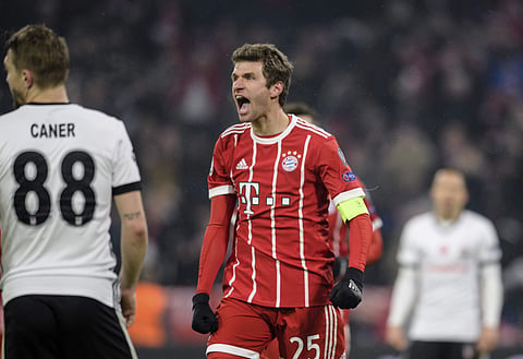 Bayern Munich's Thomas Mueller celebrates after scoring his side's third goal during the Champions League round of 16 first leg soccer match against Besiktas Istanbul. | AP