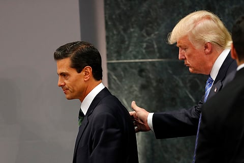 File: President Donald Trump walks with Mexico President Enrique Pena Nieto at the end of their joint statement at Los Pinos, the presidential official residence, in Mexico City, Wednesday, Aug. 31, 2016. | AP