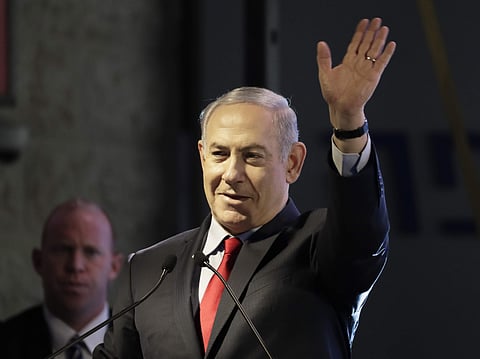 Israeli Prime Minister Benjamin Netanyahu waves during the opening ceremony for a bomb-proof emergency room in a hospital in Ashkelon, Israel, Tuesday, Feb. 20, 2018. | AP