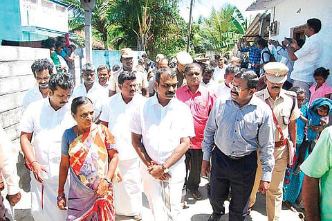 NCSC Vice Chairman L Murugan, Collector Dr L Subramanian and Villupuram SP S Jayakumar and visiting Vellamputhur village on Monday | Express