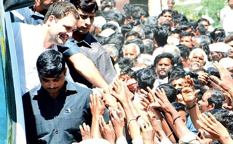 Congress president Rahul Gandhi greets supporters in Godchi village in Belagavi district on Monday | D Hemanth