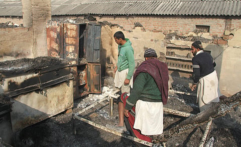 Villagers looking at their damaged house after heavy shelling by Pakistani forces at border village Jora Farm in R S Pura Sector. | PTI File Photo