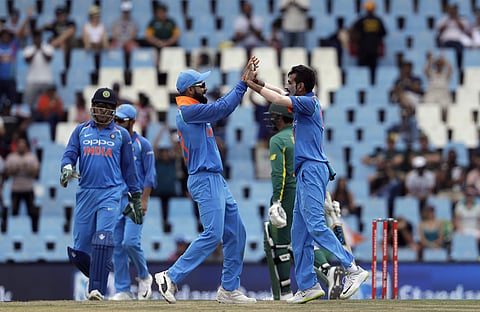 Yuzvendra Chahal (R) celebrates with captain Virat Kohli (File | AP)