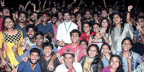 Students of Sacred Heart College, Thevara, celebrate after clinching the championship in the MG University Art Fest in Kochi on Tuesday.(