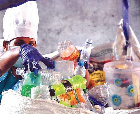 Representational image. Volunteers segregating plastic and other solid waste for treatment