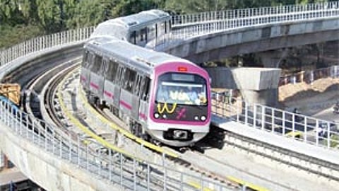 A metro train on its way to MG Road station.
