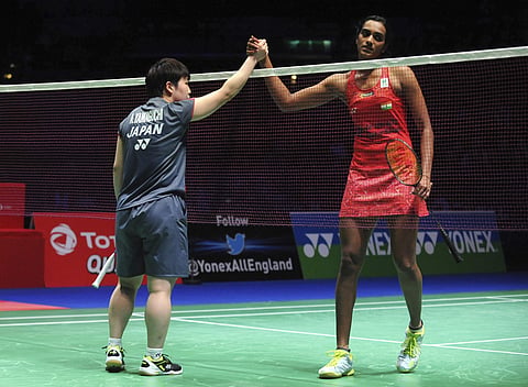 Japan's Akane Yamaguchi, left, shakes hands with India's Pusarla V Sindhu after beating her in the women's semi final match at the All England Open Badminton Championships in Birmingham, England, Saturday March 17, 2018. | AP