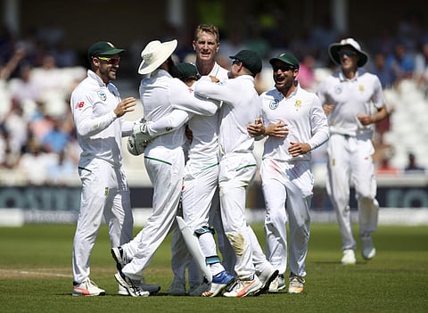South Africa's Chris Morris celebrates with team-mates after dismissing England's Alastair Cook during day four of the Second Test cricket match at Trent Bridge. | AP File Photo