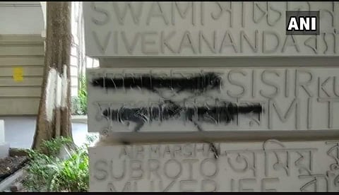 Black ink smeared on Jana Sangh founder Syama Prasad Mookerjee's name engraved on a name plate at Presidency University campus in Kolkata. | ANI