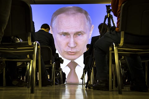 Journalists watch as Russian President Vladimir Putin gives his annual state of the nation address | AP