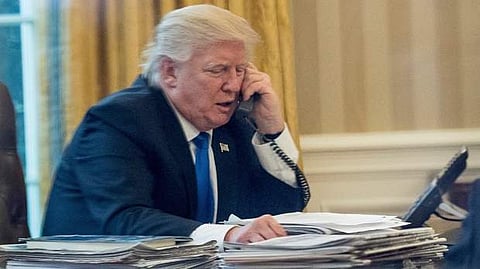 AP file image of US president Donald Trump on the phone.