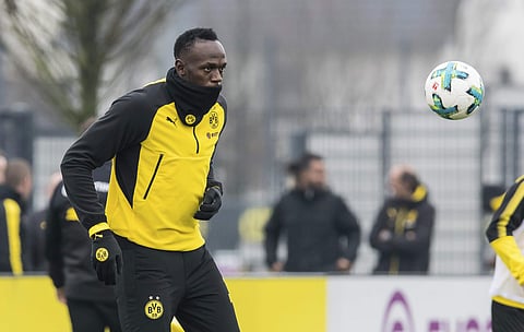 Jamaica's former sprinter Usain Bolt takes part in a practice session of the Borussia Dortmund soccer squad. | AP