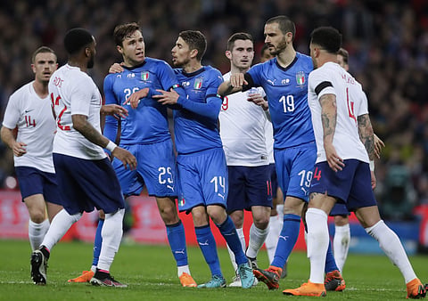 Italy's Federico Chiesa, 3rd from left, faces England's Kyle Walker, right, during the international friendly soccer match between England and Italy | AP