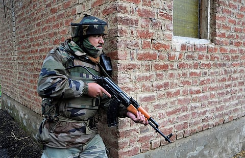 An army personnel takes his position near a house during a gunfight between militants and the security forces. (PTI file photo used for representational purpose only)