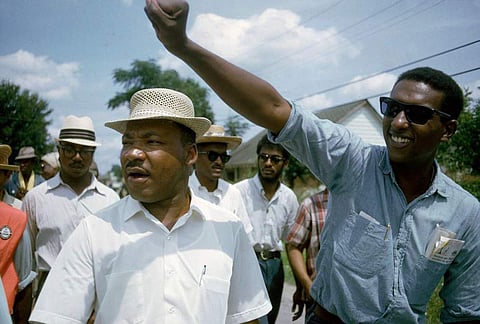 This 1966 image released by HBO shows Dr. Martin Luther King, Jr., left, and Stokely Carmichael in Jackson, Miss., at the Meredith March, used in the documentary, 'King in the Wilderness.' | AP