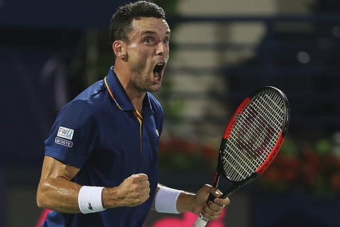 Roberto Batista Agut of Spain reacts against Lucas Pouille of France during the final match of the Dubai Duty Free Tennis Championships. | AP