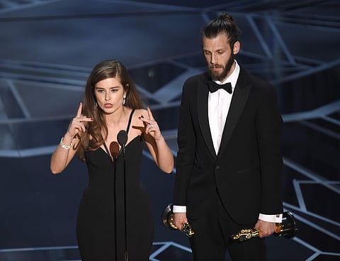 Rachel Shenton, left, and Chris Overton accept the award for best live action short for 'The Silent Child' at the Oscars | AP
