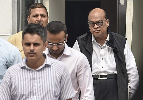 Rotomac Pens owner Vikram Kothari and his son Rahul Kothari escorted by CBI officials. (File photo | PTI)