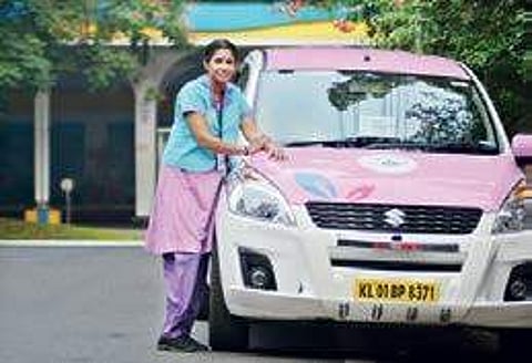 A She Taxi driver near her cab Manu R Mavelil