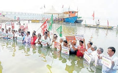 CPI activists staging a ‘Jaladeeksha’ demanding Special Category Status to State in the Krishna river at Durga Ghat in Vijayawada on Wednesday | P Ravindra Babu