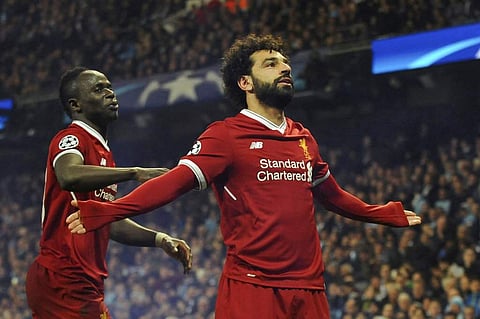 Liverpool's Mohamed Salah, right, celebrates scoring his side's first goal against Manchester City with Liverpool's Sadio Mane. (AP)