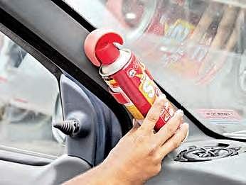 A mechanic fixing a fire extinguisher inside a car | sayantan ghosh