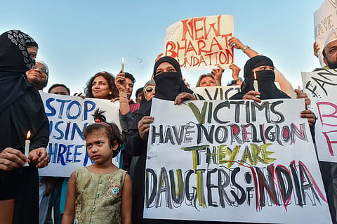 People take part in a candlelight march at the India Gate in protest over Kathua gangrape case in New Delhi. (Photo | PTI)