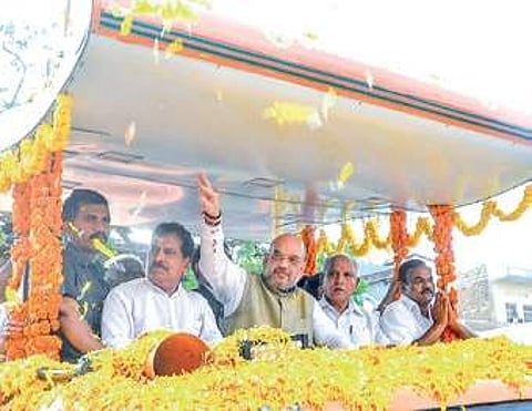 Amit Shah and B S Yeddyurappa at a roadshow in Gokak on Friday | Express