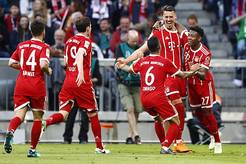 Bayern's Sandro Wagner, 2nd right, celebrates with team mates after scoring his side's second goal during the German Bundesliga soccer match between FC Bayern Munich and Borussia Moenchengladbach in Munich, Germany, Saturday, April 14, 2018. | AP
