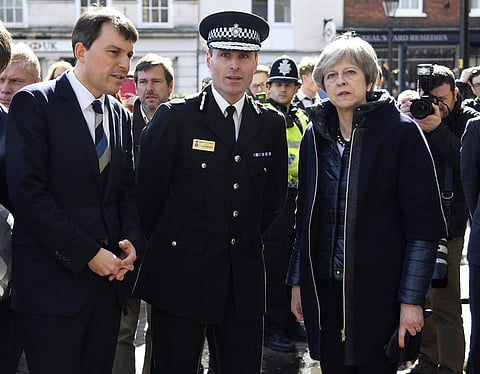 Britain's Prime Minister Theresa May (R) views the area where former Russian double agent Sergei Skripal and his daughter were found critically ill. (File | AP)