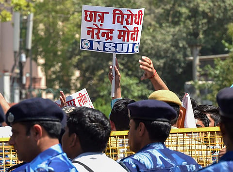 NSUI activists and 10th and 12th CBSE class students raise slogans against Union HRD Minister Prakash Javedkar regarding the alleged CBSE paper leak in New Delhi. | File PTI