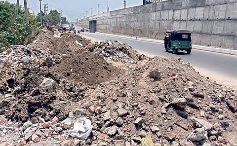 Construction debris dumped at Krishna Lanka in Vijayawada; (below) a busy spot on Sambamurthy Road becomes an eyesore | p ravindra babu