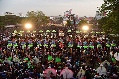 The display of ornate parasols known as Kudamattom at the southern entrance of Vadakkumnathan temple. Express | Albin Mathew