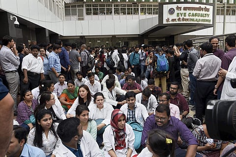 Resident doctors of the All India Institute of Medical Sciences AIIMS raise slogans during an indefinite strike. PTI