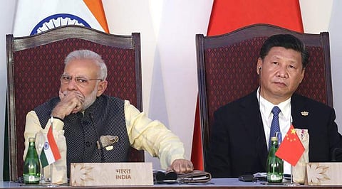 Prime Minister Narendra Modi (L) with Chinese President Xi Jinping