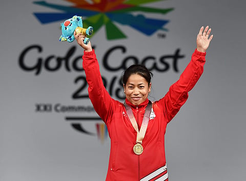Gold medalist Indian weightlifter Sanjita Chanu poses for a photo during the medal ceremony of women's 53kg Weightlifting event during the Commonwealth Games 2018. | PTI
