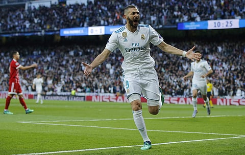 Real Madrid's Karim Benzema celebrates after scoring his side's opening goal during the Champions League semifinal second leg soccer match between Real Madrid and FC Bayern Munich at the Santiago Bernabeu stadium in Madrid, Spain, Tuesday, May 1, 2018. |