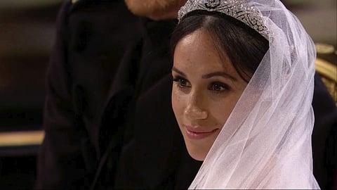 Meghan Markle listens during her wedding ceremony with Britain's Prince Harry at St. George's Chapel in Windsor Castle in Windsor, near London, England, Saturday, May 19, 2018. | Associated Press