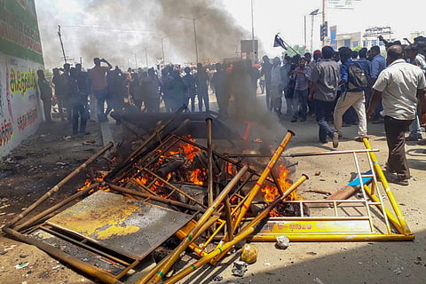 Smoke billows from burning barricades as agitators march through streets demanding the closure of Vedanta's Sterlite Copper unit in Thoothkudi | PTI