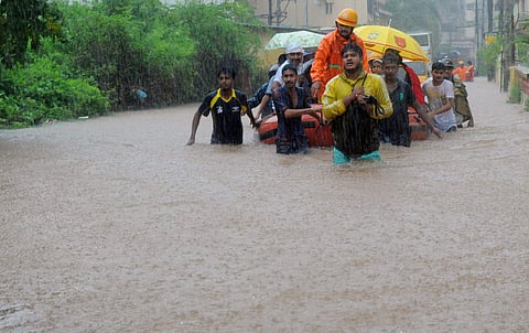 Fire personnel rescue school children and public at Aleke.(Express Photo)