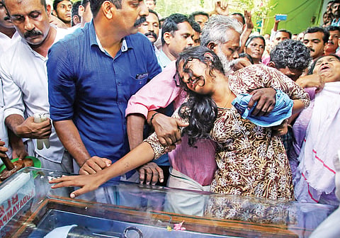 Kevin Joseph’s father Joseph Jacob trying to console Kevin’s wife Neenu when the mortal remains were brought to Platharayil house on Tuesday | Vishnu Prathap