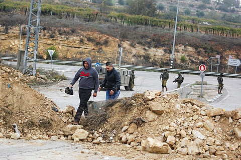 Israeli soldiers stand guard at one of the exits of the West Bank city (File | AP)