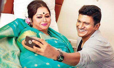Puneeth Rajkumar and Saroja Devi in Natasarvabhouma.
