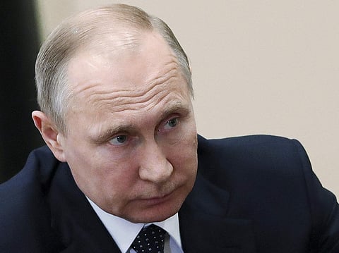 Russian President Vladimir Putin listens during a meeting in Moscow, Russia, Friday, April 13, 2018. | Associated Press