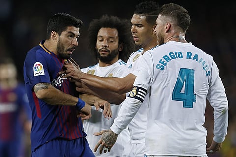 Luis Suarez felt he had been elbowed by Sergio Ramos, prompting the first round of scuffles | AP