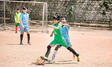 Bengaluru: School boy from city scores a goal on football field