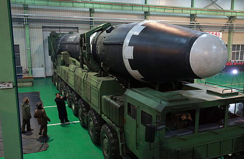 This Nov. 29, 2017, file image provided by the North Korean government Nov. 30, 2017, shows North Korean leader Kim Jong Un, third from left, and what the North Korean government calls the Hwasong-15 intercontinental ballistic missile, in North Korea. | A